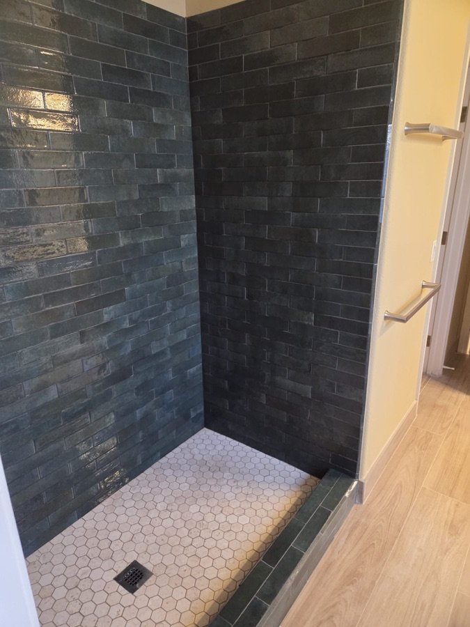 Dark tile walk-in shower